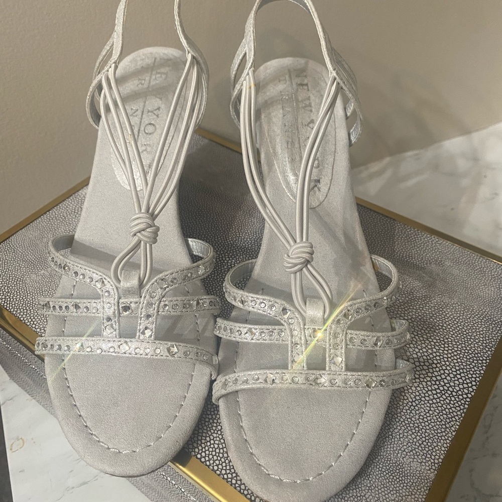 Silver strap wedge dress sandals with rhinestone accents.  Never worn NWOT